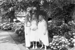 Black and white portrait of mother and daughters posing naturally outdoors CFP1037-1M