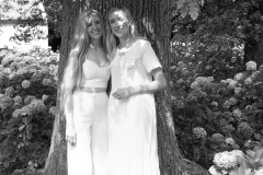 Black and white portrait of sisters posing naturally outdoors CFP1038-1M