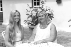 Black and white portrait of mother and daughter at a table CFP1055-1M