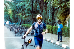 Cyclist riding along Lake Kivu during Ironman Rwanda 70.3