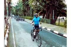 Cyclist riding along Lake Kivu during Ironman Rwanda 70.3