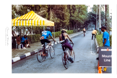 Cyclist riding along Lake Kivu during Ironman Rwanda 70.3