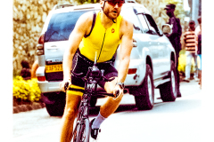 Cyclist riding along Lake Kivu during Ironman Rwanda 70.3