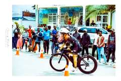 Cyclist riding along Lake Kivu during Ironman Rwanda 70.3