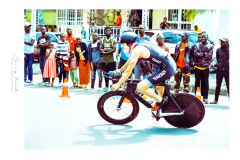 Cyclist riding along Lake Kivu during Ironman Rwanda 70.3