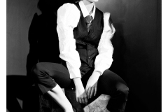 Artistic studio portrait with high contrast lighting black and white