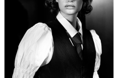 Studioblack and white portrait with strong directional lighting and shadows