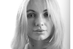 Close-up studio portrait of Vicki Alexia with soft tones
