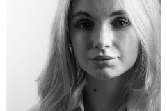 Dramatic black and white portrait of Vicki Alexia with shadow lightin